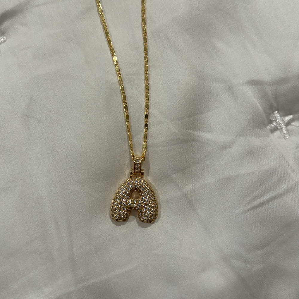 A initial necklace gold